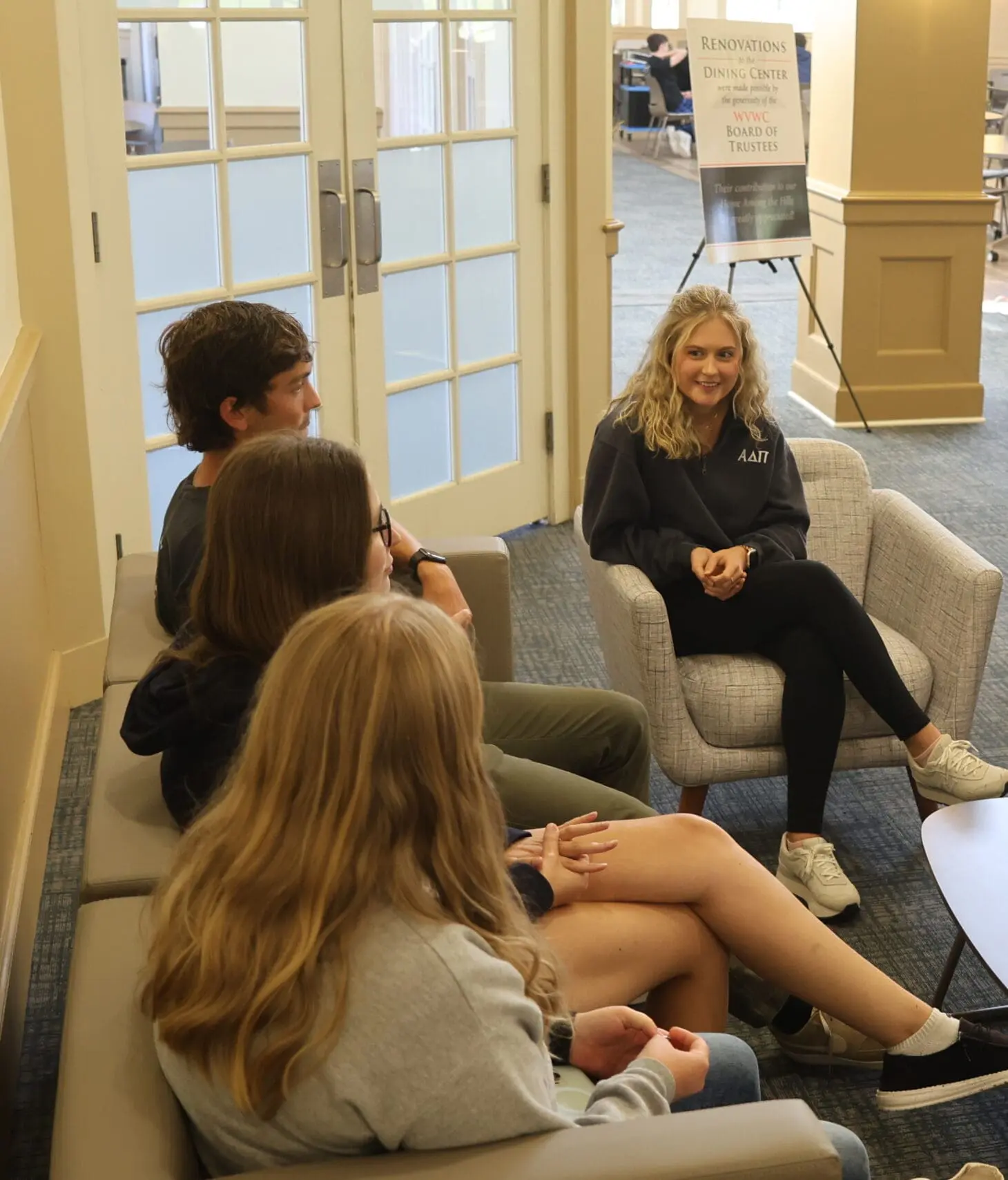 Students sitting on couch having a conversation